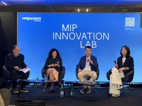 Four panelists seated onstage before a screen reading “MIP Innovation Lab” at MIPCOM Cannes.