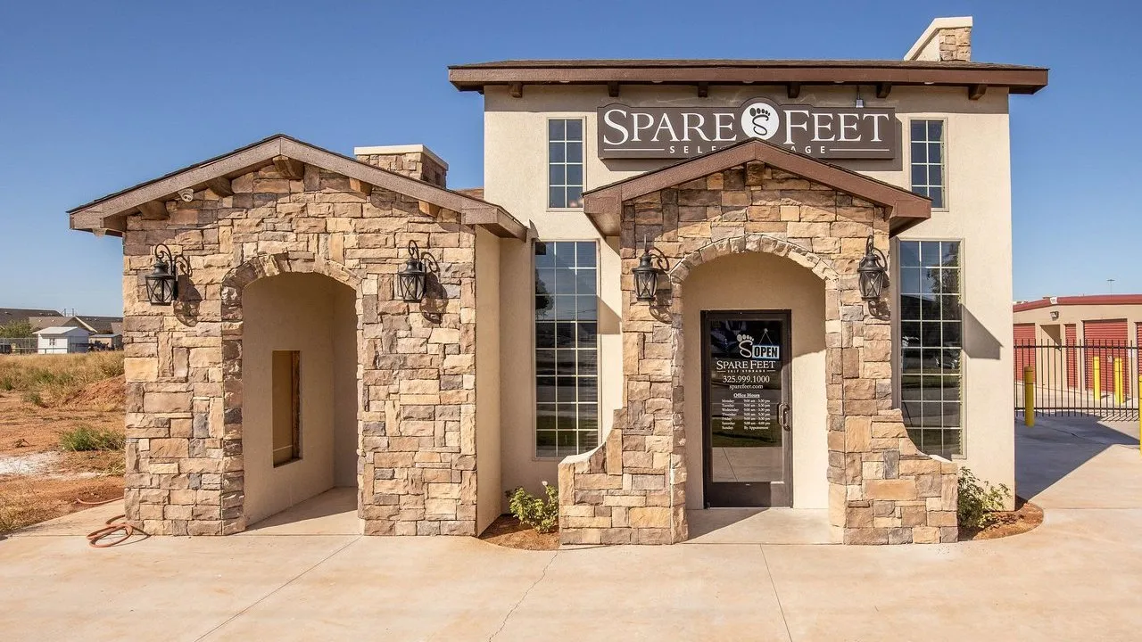 A stone-fronted Spare Feet self-storage building with entrance arches.