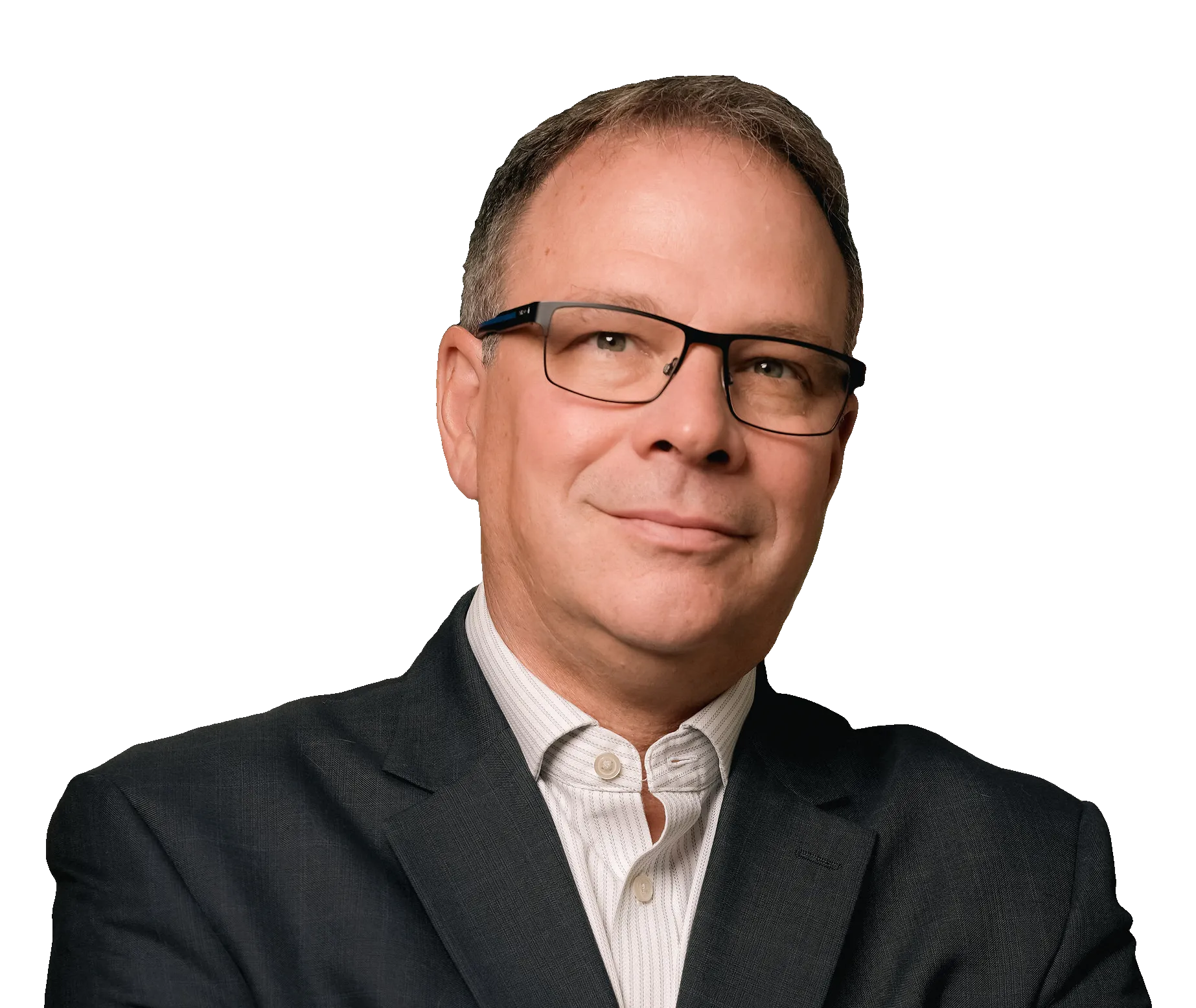 Don Garrison in glasses and a dark suit jacket, standing with arms crossed in an industrial setting.